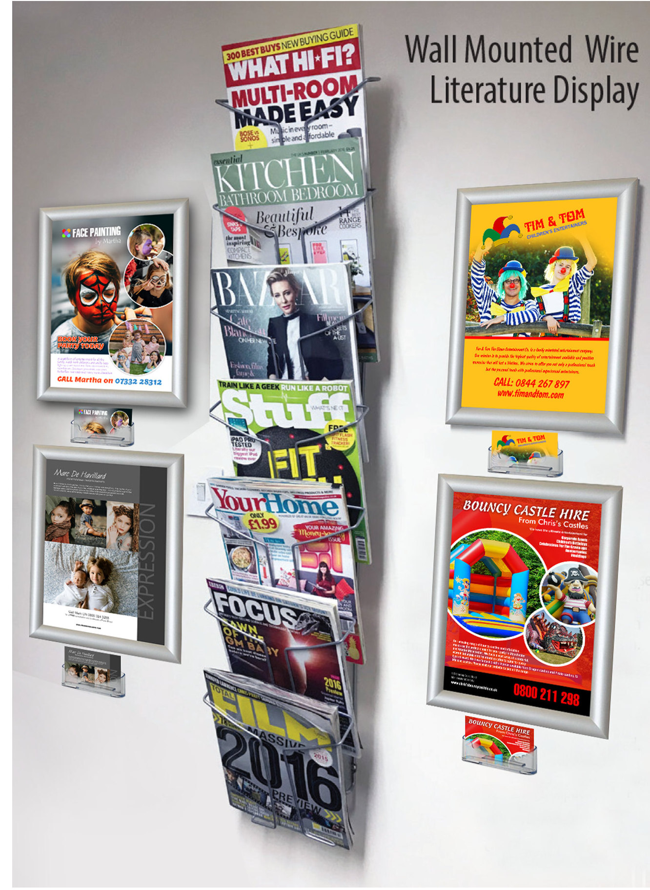 A wall-mounted Freemags rack filled with magazines, with A4 poster frames fitted around it